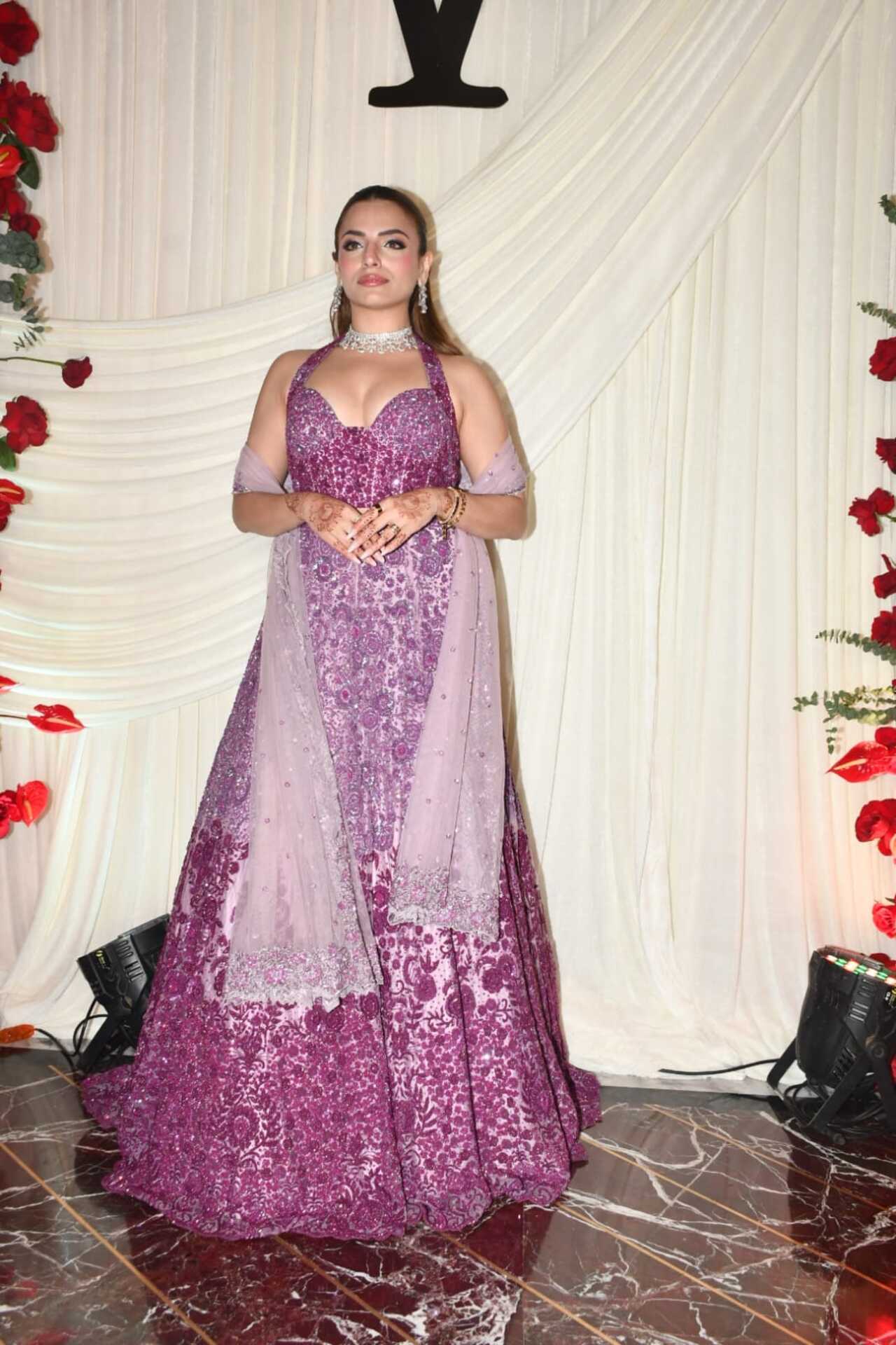 <p>Sukriti Kakar looked absolutely breathtaking in an embellished lilac lehenga paired with a stylish halter-neck blouse and a flowing white dupatta.</p>